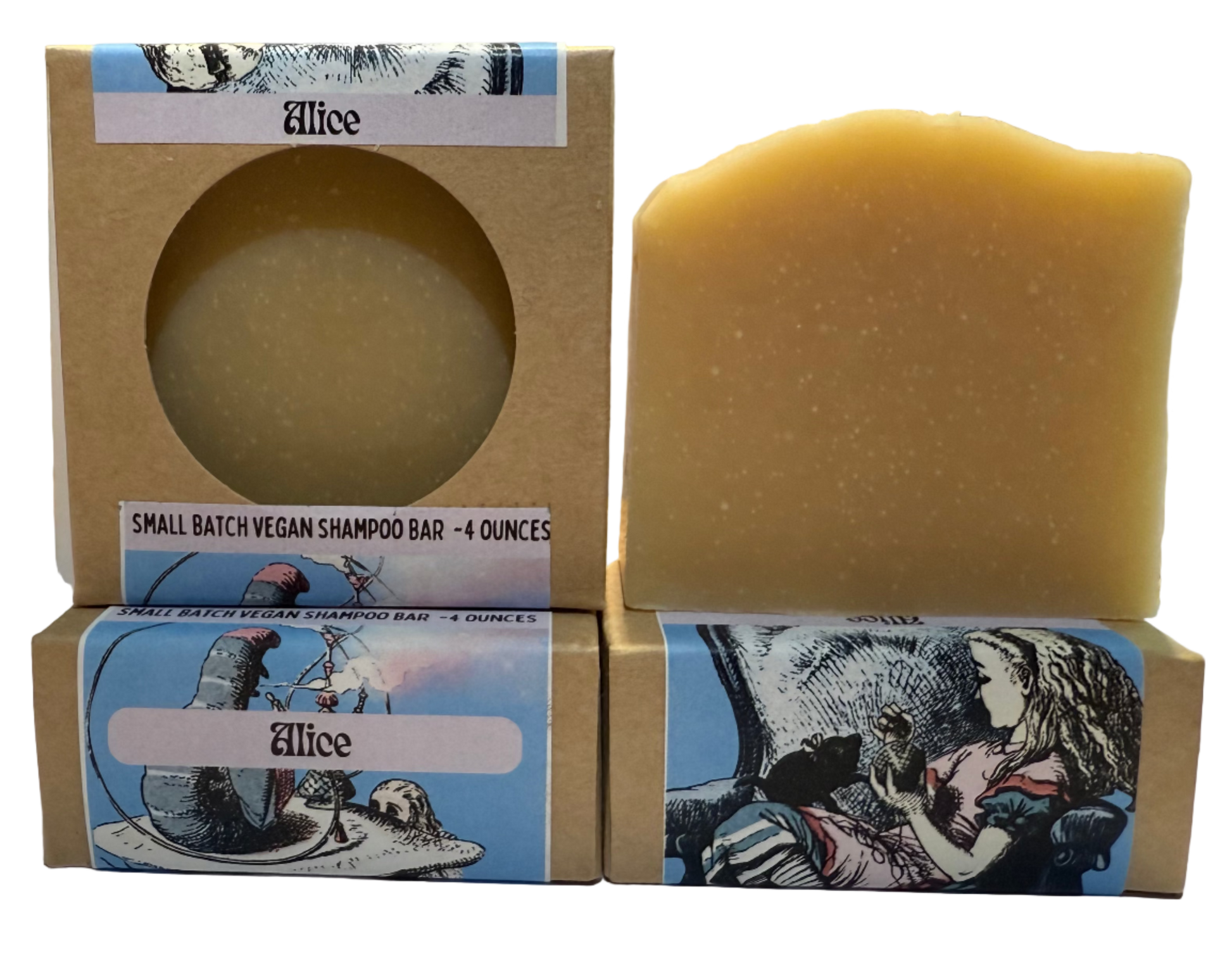 Three small batch vegan shampoo bars with decorative boxes on a table.