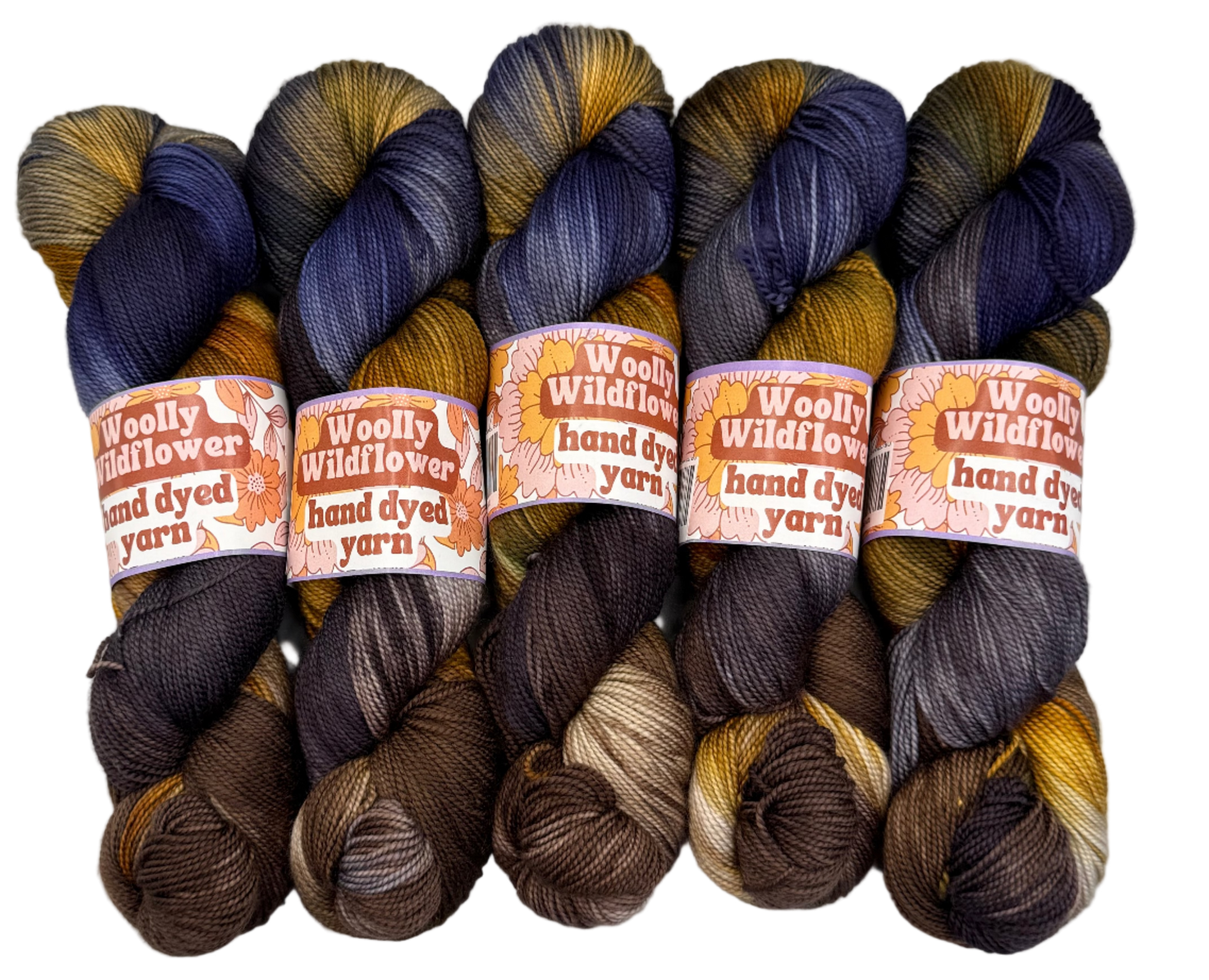 Five skeins of hand-dyed yarn in brown, blue, and orange on a white background with 'Woolly Wildflower' labels.