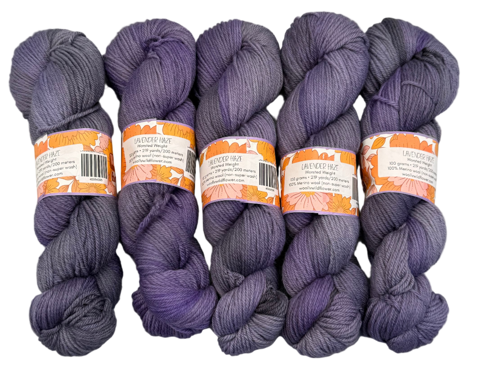 Five skeins of purple yarn with labels on a gray background