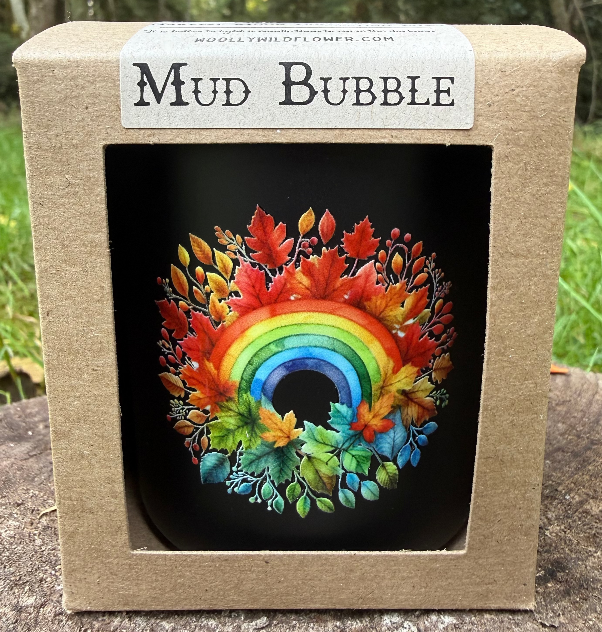 Mud Bubble product packaging with a colorful rainbow design on a natural background