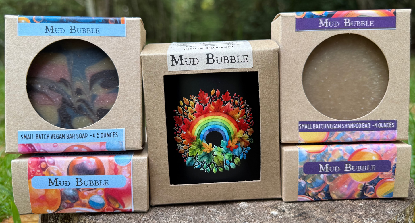 Mud Bubble soap packaging with colorful designs on a natural background