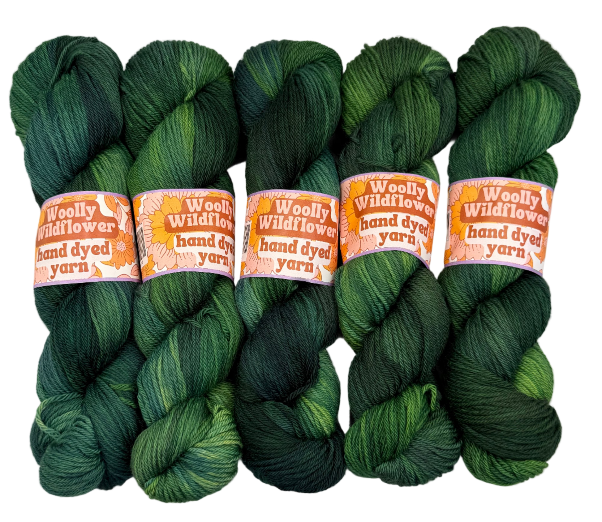 Five skeins of green hand-dyed yarn with 'Woolly Wildflower' labels on a white background.