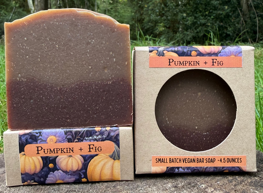Bar of soap with packaging labeled 'Pumpkin + Fig' against a natural background