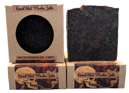 Two soap bars and their packaging with 'Quad Shot Mocha Latte' branding on a gray background.
