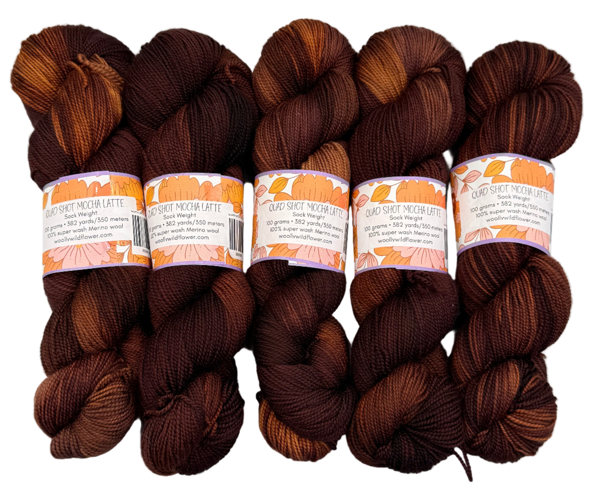 Five skeins of brown yarn with lighter brown accents on a light gray background