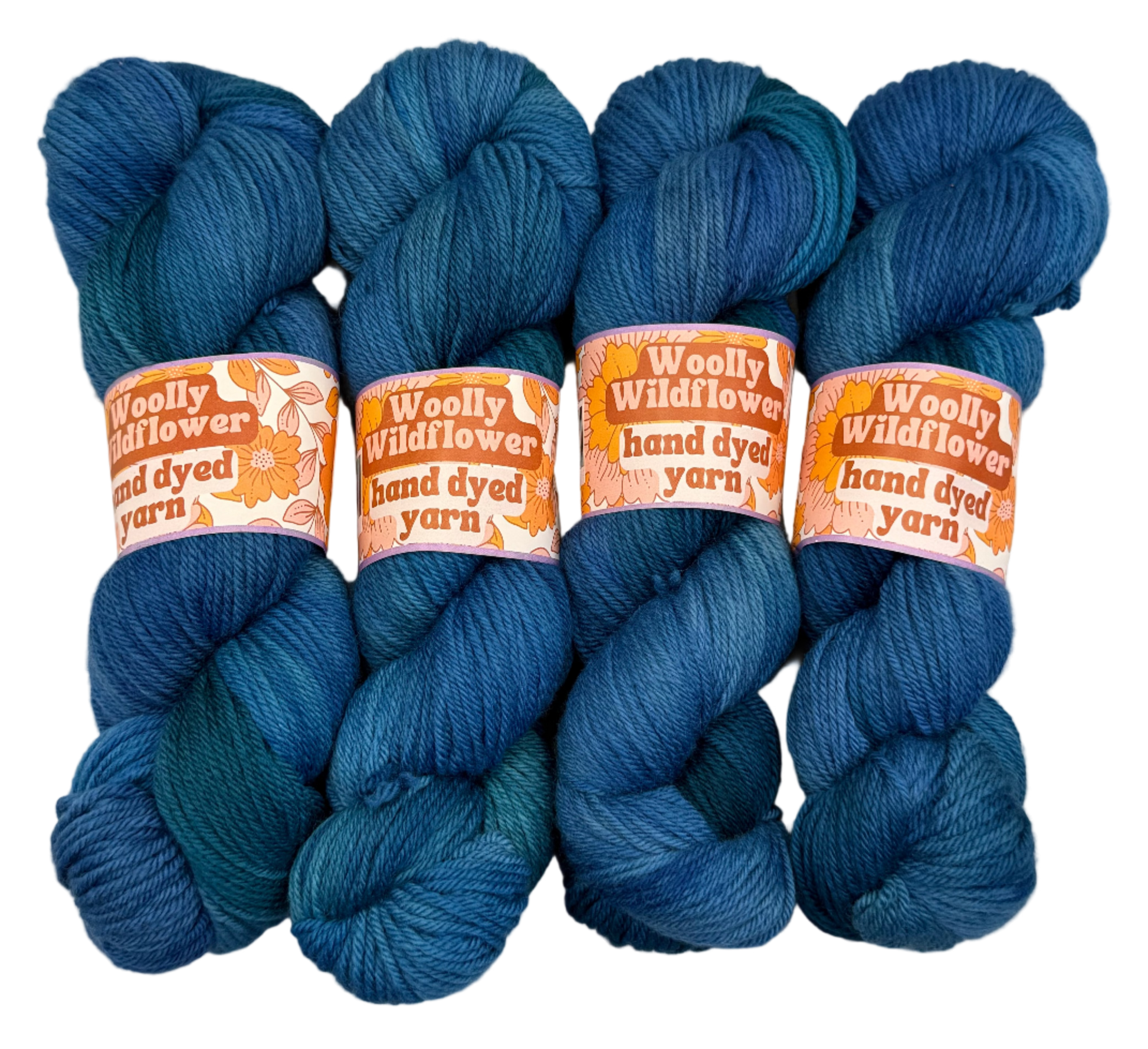Four blue skeins of yarn with 'Woolly Wildflower' labels on a light gray background