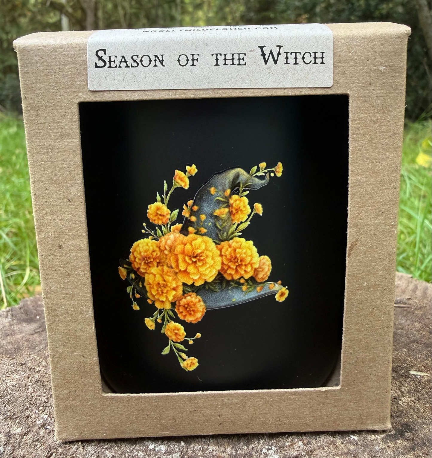 Product packaging with 'Season of the Witch' label and floral design on a natural background