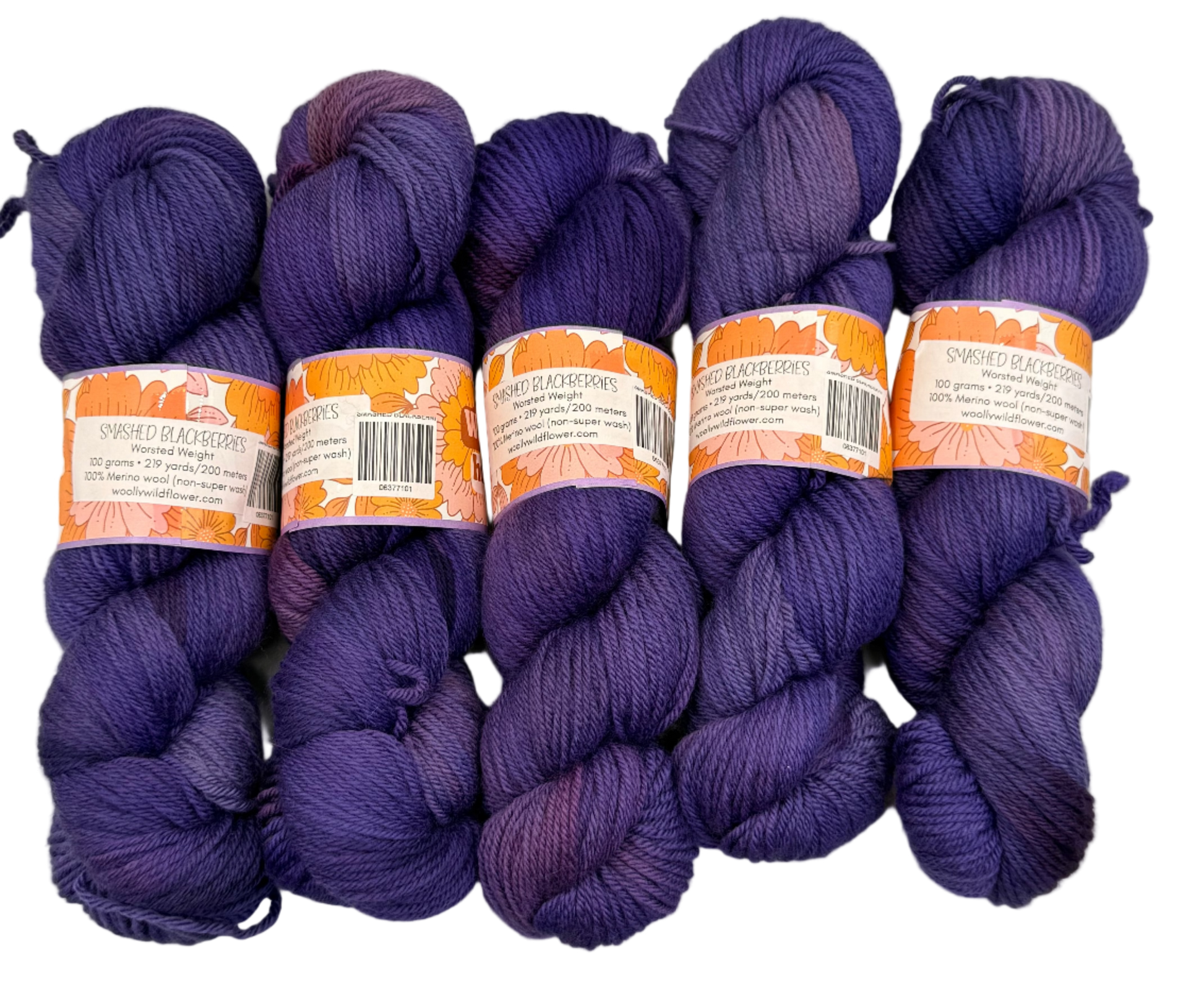 Five skeins of purple yarn with labels on a light gray background