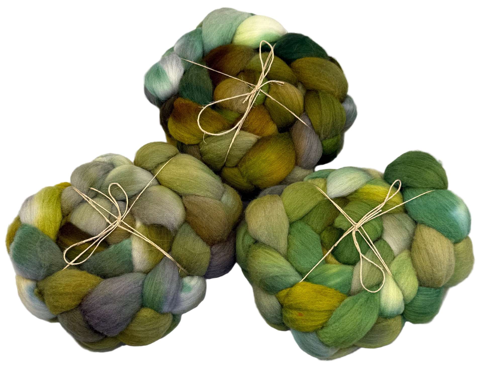 Three skeins of multicolored yarn tied together on a white background