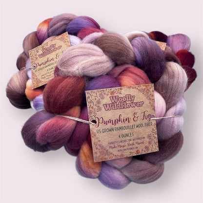 Multicolored yarn skein with 'Woolly Wildflower' label on a white background