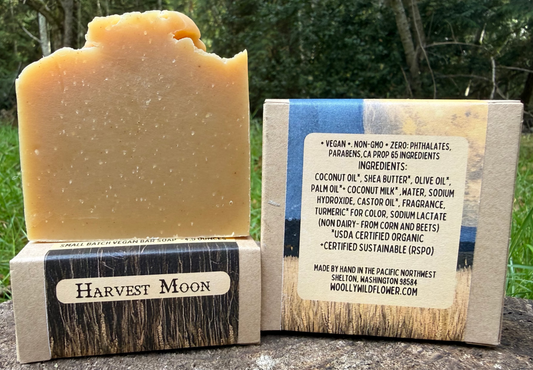 Bar of soap with a label on a natural background