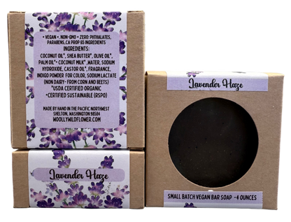 Lavender Haze soap bar in a cardboard box with a purple label on a gray background