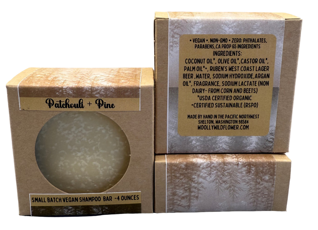 Vegan shampoo bar in packaging with visible label on a gray background