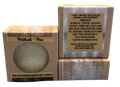 Vegan shampoo bar in packaging with visible label on a gray background