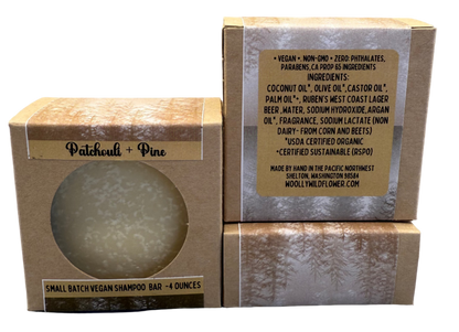 Vegan shampoo bar in packaging with visible label on a gray background
