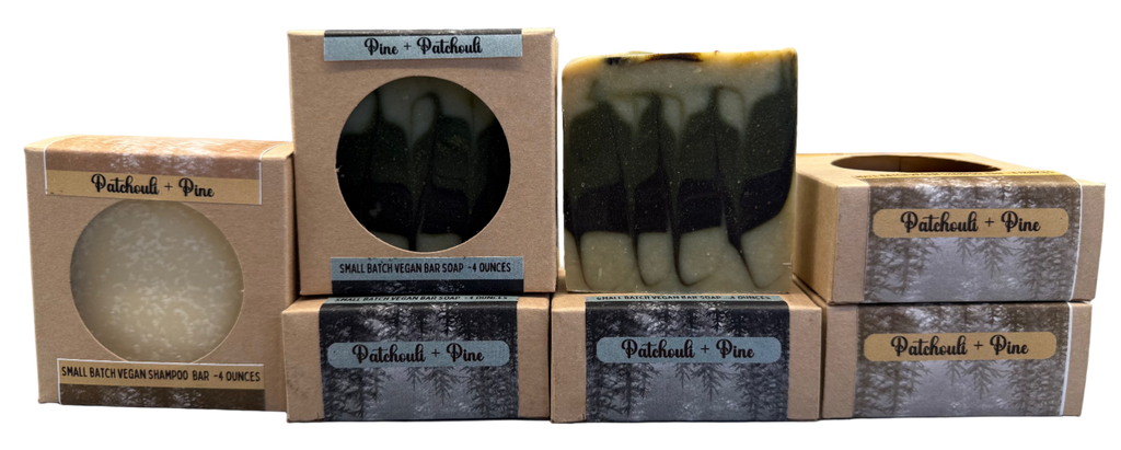 Bar of soap with packaging labeled 'Patchouli + Pine' on a neutral background
