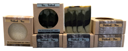 Bar of soap with packaging labeled 'Patchouli + Pine' on a neutral background