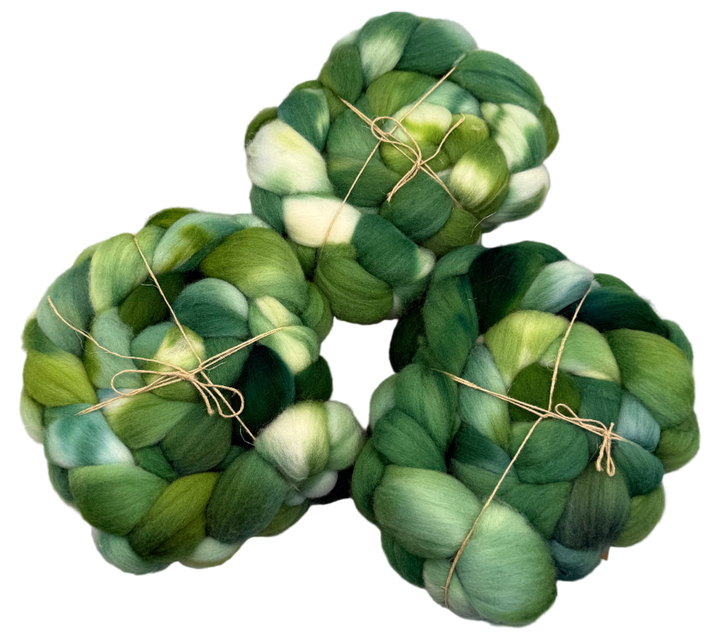 Three skeins of green fibers tied together on a light gray background