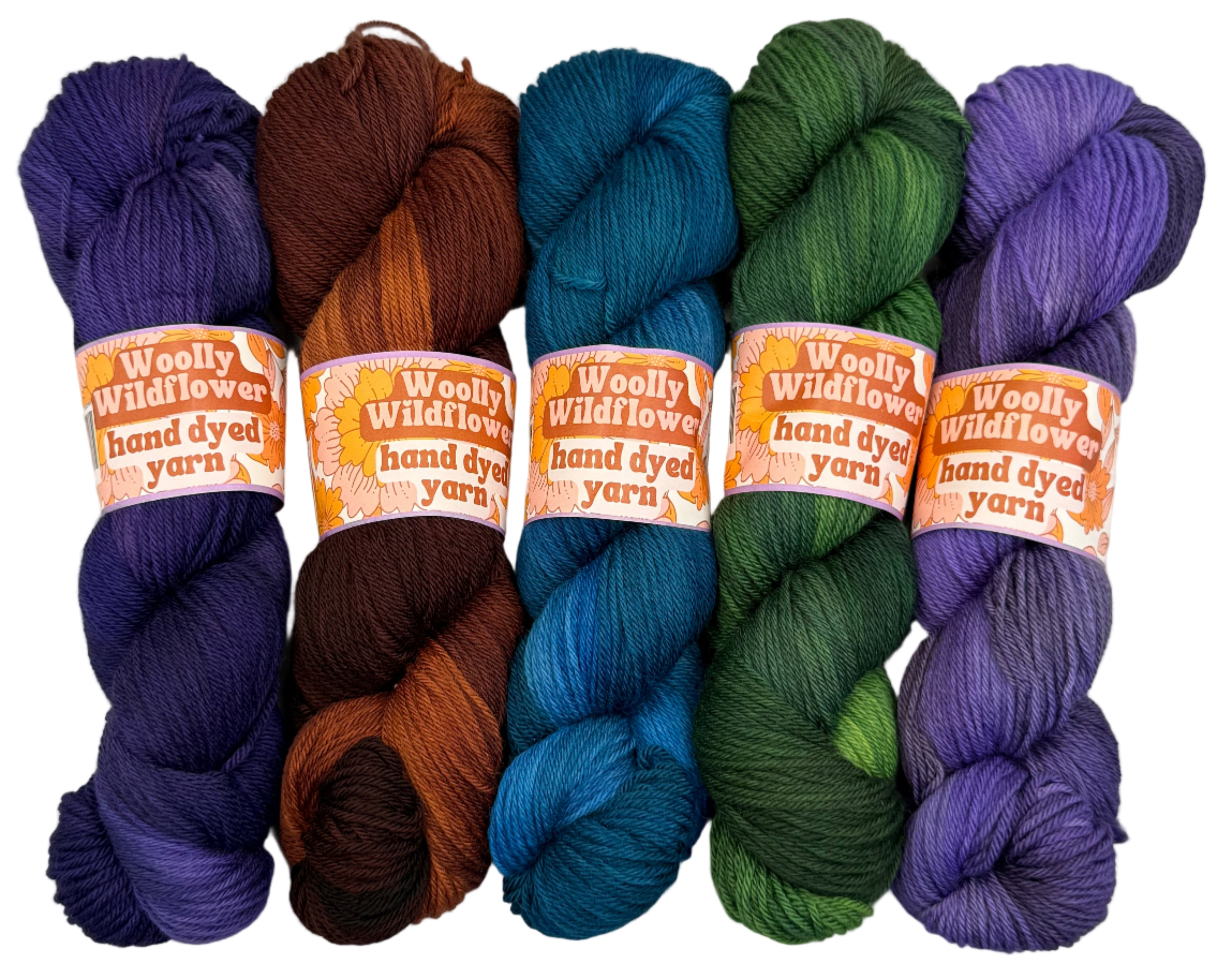 Five skeins of hand-dyed yarn in purple, brown, blue, green, and purple on a white background with 'Woolly Wildflowers' labels.