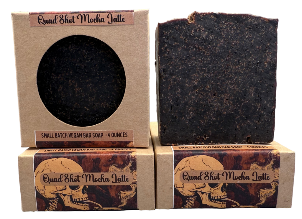 Two soap bars and their packaging with 'Quad Shot Mocha Latte' branding on a gray background.
