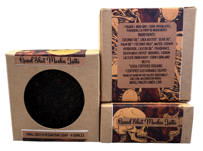 Three cardboard boxes with a soap bar inside on a gray background