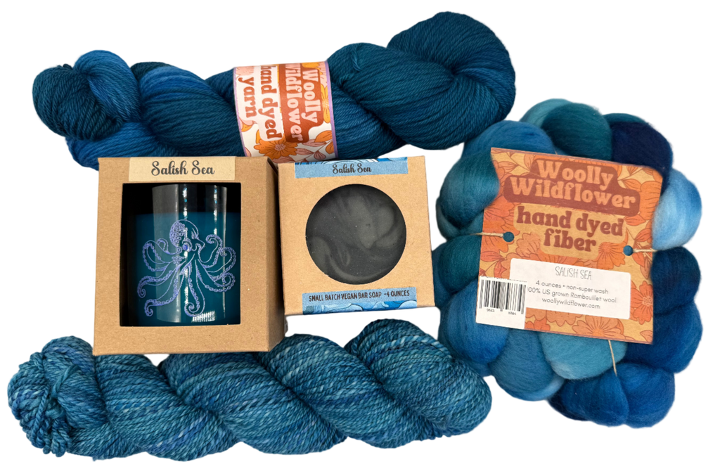 Blue yarn skeins with packaging and labels on a light gray background