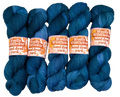 Five blue skeins of yarn with 'Woolly Wildflower' labels on a light gray background