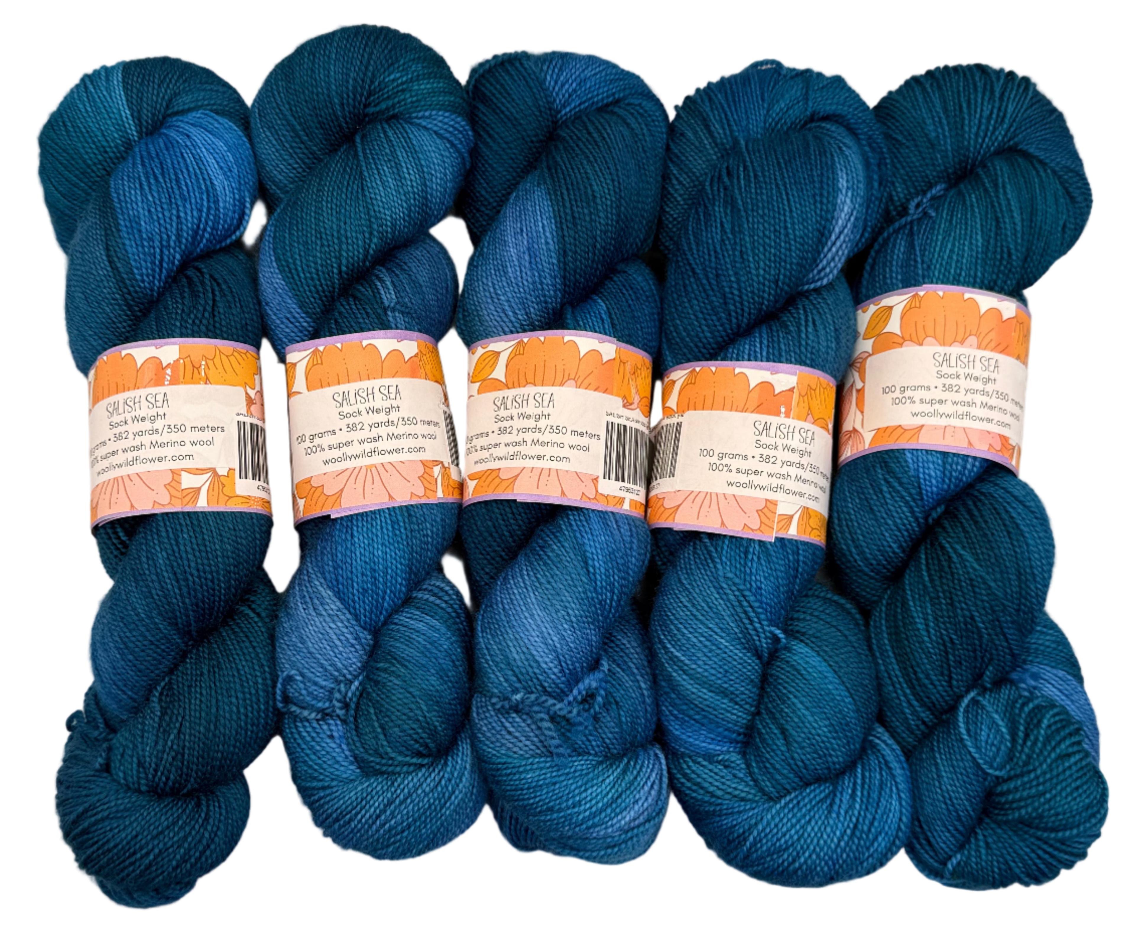 Five skeins of blue yarn with labels on a light gray background