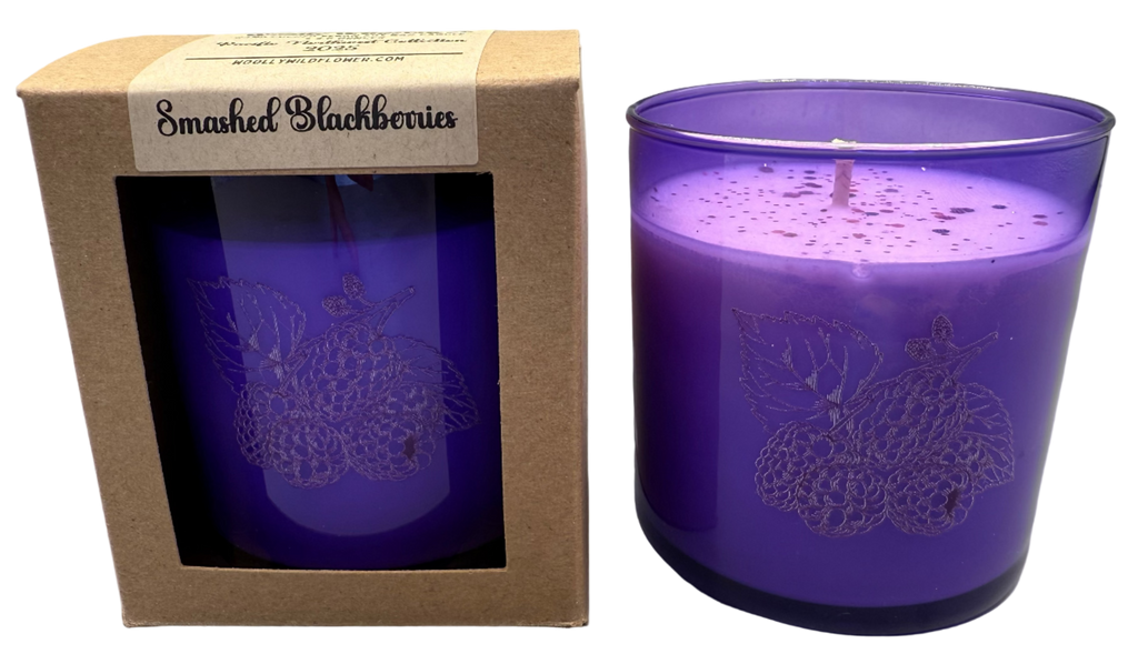 Purple candle in a decorative box with 'Smashed Blackberries' label on a white background