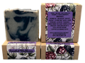 Bar of soap with a floral packaging label on a gray background