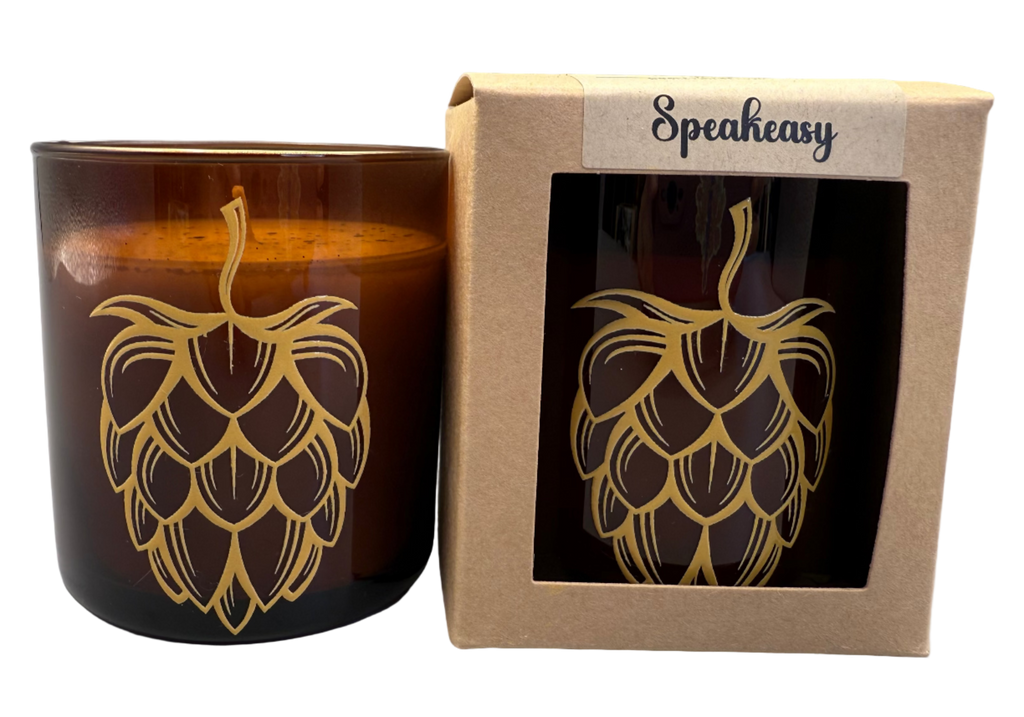 Candle with hop design and Speakeasy packaging on a white background