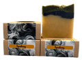 Two stacked soap bars with Speakeasy branding on a gray background