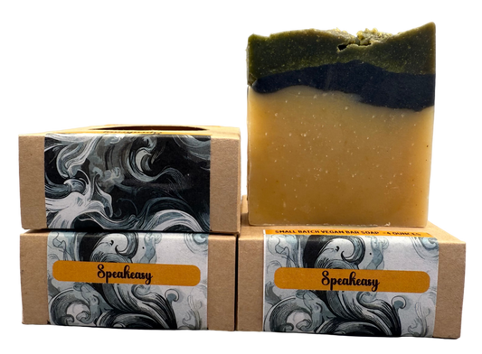 Two stacked soap bars with Speakeasy branding on a gray background